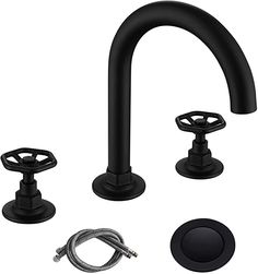 the black faucet is next to two hoses