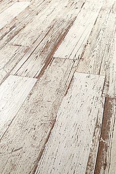 an old white wood floor is shown in this image