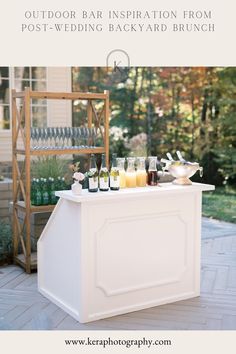 an outdoor bar with drinks on it and text overlay that reads, how to host an outdoor bar inspiration from post - wedding backyard brunch