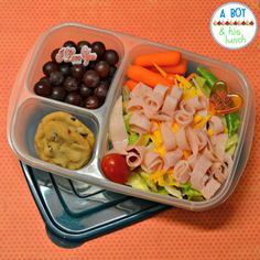 two plastic containers filled with food on top of a table