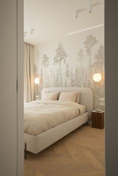 a large bed sitting in the middle of a bedroom next to a wall with plants on it