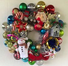 a christmas wreath with ornaments on it