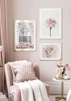 a living room with pink walls and pictures on the wall