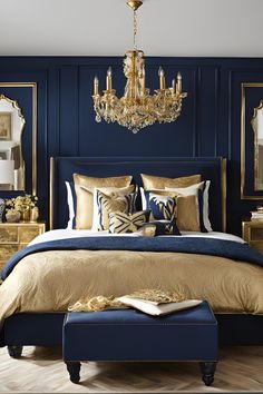 a bedroom with blue walls, gold bedding and a chandelier hanging from the ceiling