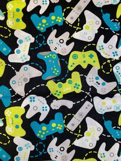 a black background with blue, yellow and green video game controllers on it's sides