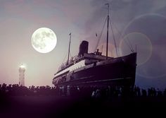 a large boat sitting on top of a body of water next to a light house