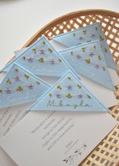 the wedding stationery is laid out on top of each other