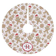 a white and red christmas tree skirt with gingerbreads on the front, polka dot dots