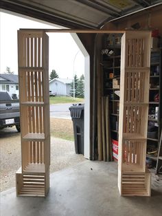 two wooden shelves in the back of a garage