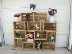 a wooden shelf filled with lots of toy animals