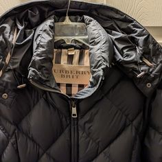 Burberry Brit Limited Edition Down Puffer Jacket With Vintage Check Lining. This Classic And Timeless Navy Blue Jacket Will Be A Perfect Addition To Any Wardrobe, For Many Years To Come. A Beautiful Feminine Fit, Full Collar And Deep/Full Hood, Piped With The Classic Burberry Vintage Fabric For Extra Style. The Hood Is Removable, For Those "Non-Precipitation" Days. Perfect For The Ski Slopes Or A Night Out On The Town, And Everything In Between. Great Style Never Goes Out Of Style! Size M Burberry Puffer Jacket, Hot Takes, Navy Blue Jacket, Burberry Vintage, Down Puffer Jacket, Ski Slopes, Burberry Brit, Burberry Jacket, Blue Jacket