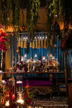 a table with candles and flowers on it