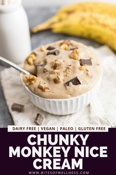 a bowl of chunk monkey ice cream with chocolate chips on top and bananas in the background