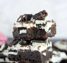 three brownies stacked on top of each other with oreo cookies and cream in the middle