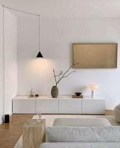 a living room with white walls and furniture