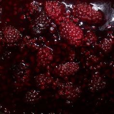 raspberries are being cooked in a pot with water on the bottom and inside