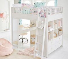 a white bunk bed sitting next to a desk and chair in a child's room