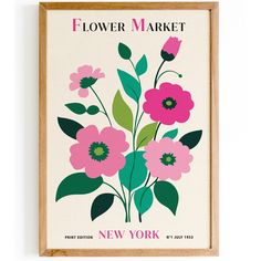 a flower market poster hanging on the wall above a wooden framed sign that reads, new york