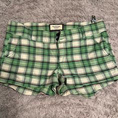 Abercrombie Green Pink Plaid Shorts Nwt Size 10 Fitted Plaid Casual Shorts, Fitted Casual Plaid Shorts, Preppy Plaid Cotton Shorts, Preppy Shorts With Pockets, Preppy Short-length Bottoms With Pockets, Preppy Fitted Cotton Shorts, Fitted Plaid Cotton Shorts, Abercrombie And Fitch Shorts, Brown Plaid