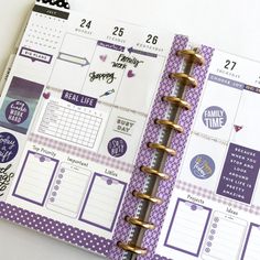 an open planner book with stickers on it