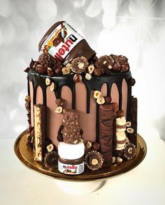 a cake with chocolate icing and nuts on top