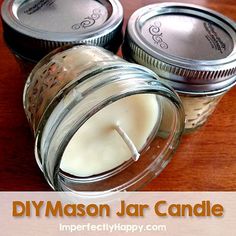 three mason jar candles on a table with text overlay that reads diy mason jar candle