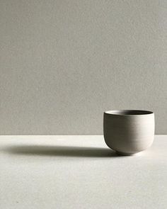 a white bowl sitting on top of a table