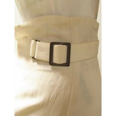 A cream colored rayon and linen high-waisted skirt from Matsuda. With a back zipper and side buckles, the waist can be cinched for a perfect fit. The mid-length skirt falls to a feminine tulip shape.