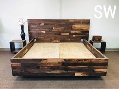 a bed made out of wood sitting on top of a carpeted floor next to a vase