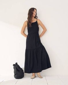 Made in a perfectly cool linen blend, this sleeveless maxi dress falls effortlessly for a quick, easy and trendy vacation style.

Fit & Cut
- Straight: Falls straight with a little extra room throughout the body
- Sleeveless
- 49.5" front body length (size 8)

Design Details
- Linen and viscose blend
- Square neckline
- Side zipper closure
- Maxi length Long Black Dress Casual, Straight Maxi Dress, Coast Outfit, Maxi Dresses Fall, Maxi Robes, Vacation Style, Midi Maxi Dress, Dresses Dresses, Black Linen