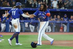 the baseball players are congratulating each other on the field after their win over the dodgers