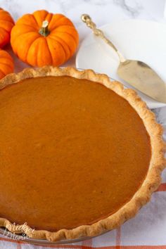 a pumpkin pie sitting on top of a table