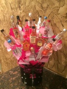 a vase filled with lots of different types of liquor