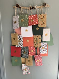 a wall hanging made out of many different types of gift bags and wrapping paper with stars on them