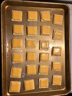 a pan filled with yellow squares of food