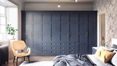 a bedroom with blue cabinets and a white rug