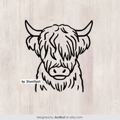 a drawing of a cow's head on a wooden background with the words by juliat