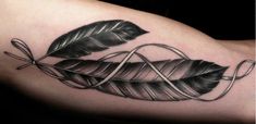 a black and white photo of a leaf tattoo