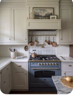 a kitchen with an oven, stove and counter tops in it's center island