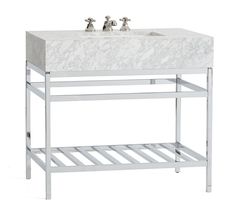 a white marble sink and shelf with two faucets on each side, against a white background