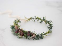 A winter flower crown in beautiful tones of green and brown. Thanks to the use of artificial flowers and leaves, the crown is durable. It is a special touch to your bohemian look. A flower crown is more beautiful than the pictures. Is perfect for garden wedding. Head circumference: one size fits all (adjustable) We offer customized accessories, matching the floral crown. Here you can buy a matching floral boutonniere: https://www.etsy.com/listing/672949700/customized-flower-boutonniere You can a Forest Crown, Christmas Headdress, Floral Boutonniere, Customized Accessories, Accessories Matching, Flower Girl Halo, Girls Halo, Woodland Floral, Headpiece Flower