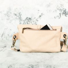 This Beige Leather Fanny Pack is the ideal bag if you like carrying all your necessities, keep your hands free and look effortlessly fashionable at the same time! Perfect for festivals, markets and travelling. Simple and beautiful bag made of a high quality Italian leather, which is soft to touch, strong, durable and a very fine material. Top grade thicker leather is used for the adjustable belt. This hip bag features one separate compartment closed by a zipper in the back and another zippered p Trendy Travel Belt Bag Shaped Like A Tote, Chic Travel Pouch For Mobile Phone, Multifunctional Rectangular Belt Bag For On-the-go, Multifunctional Shoulder Belt Bag For Travel, Multifunctional Travel Belt Bag, Versatile Hobo Bag With Mobile Phone Bag For On-the-go, Versatile Hobo Bag With Mobile Phone Pocket For On-the-go, Multifunctional Crossbody Belt Bag For On-the-go, Rectangular Belt Bag With Zipper Pocket For On-the-go