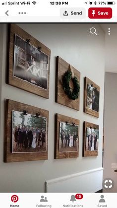 the wall is decorated with pictures and wreaths on it's sides, along with a fireplace mantel