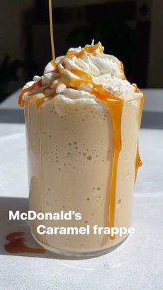 a caramel drink with whipped cream and caramel drizzle