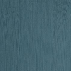 a blue wood textured background that looks like it has been painted in teal