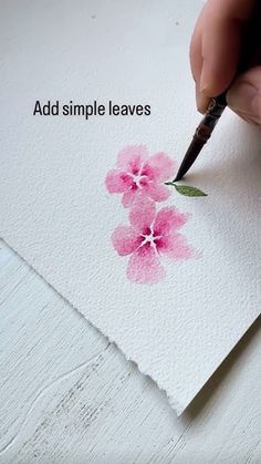 someone is drawing flowers with watercolors on paper and the words, add simple leaves