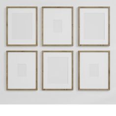 four square frames are arranged on the wall, each with a different color and size