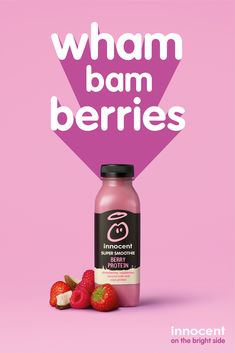 a bottle of juice and some strawberries on a pink background with the words wham ban berries