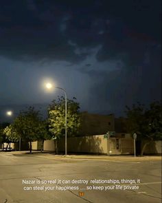 an empty parking lot at night with the moon in the sky