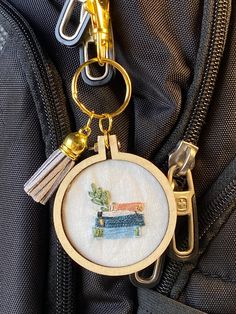 a close up of a key chain attached to a backpack